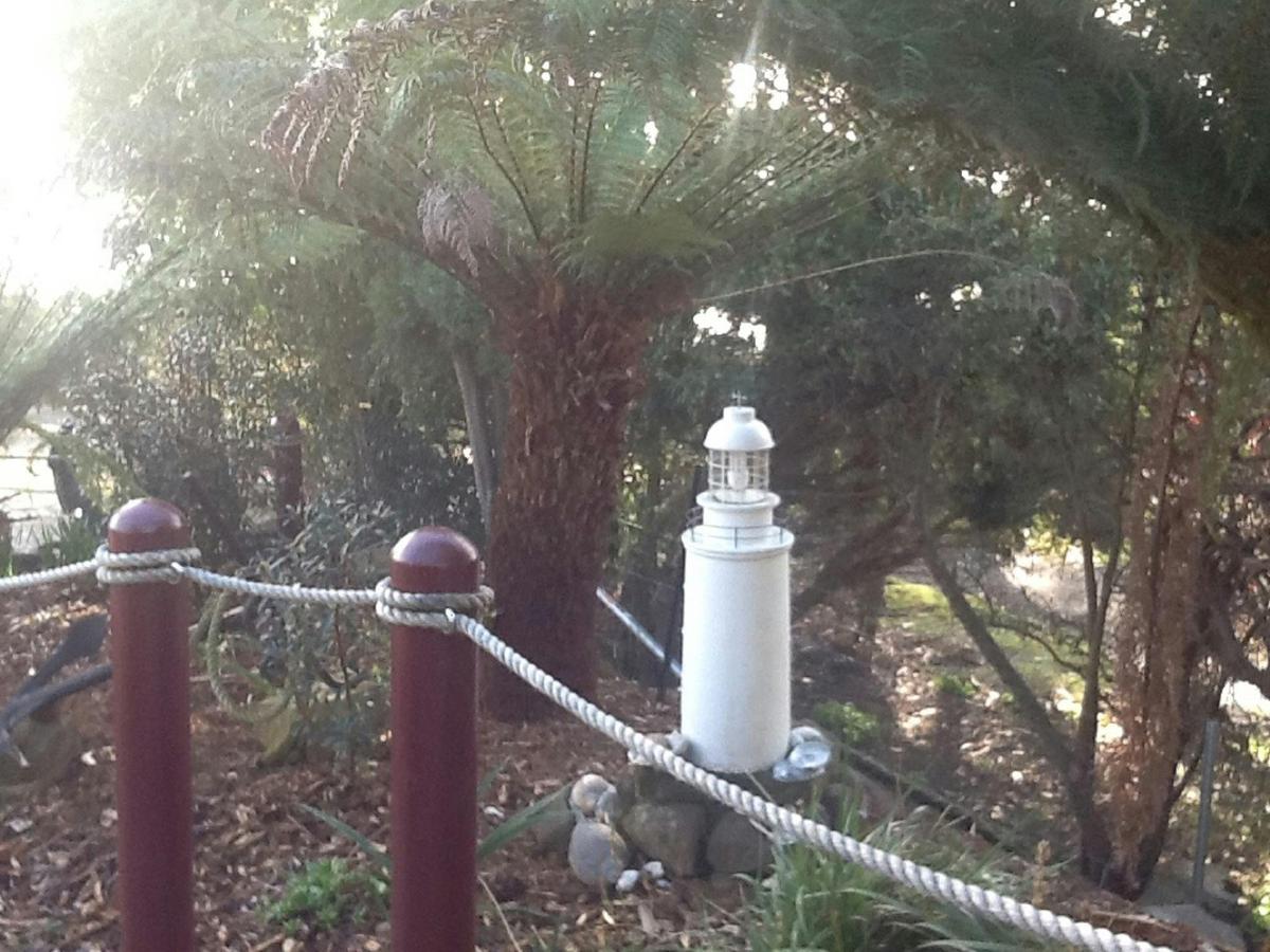 light house in front garden