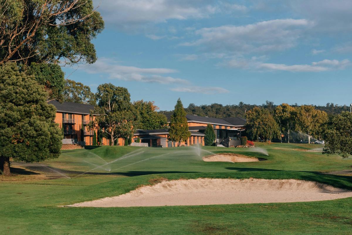 Golf course with Country Club Resort in background