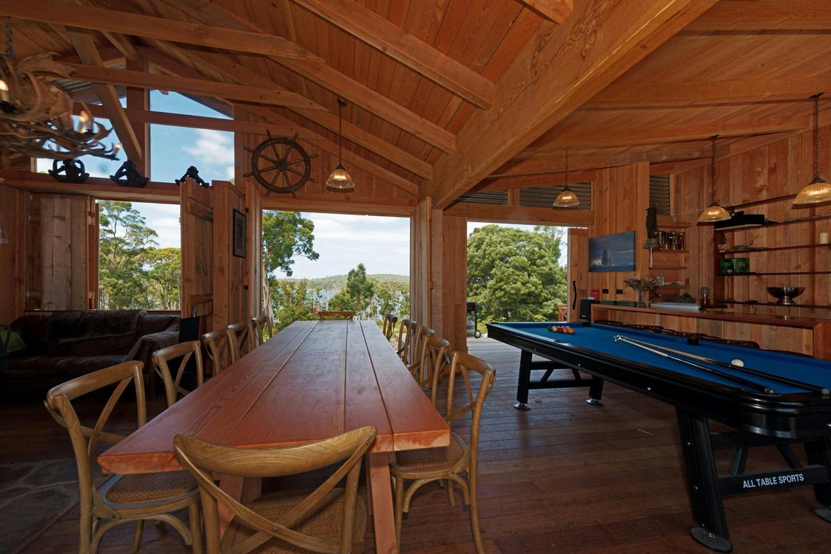 Bruny Island Lodge dining table and pool table view out to Mickeys bay