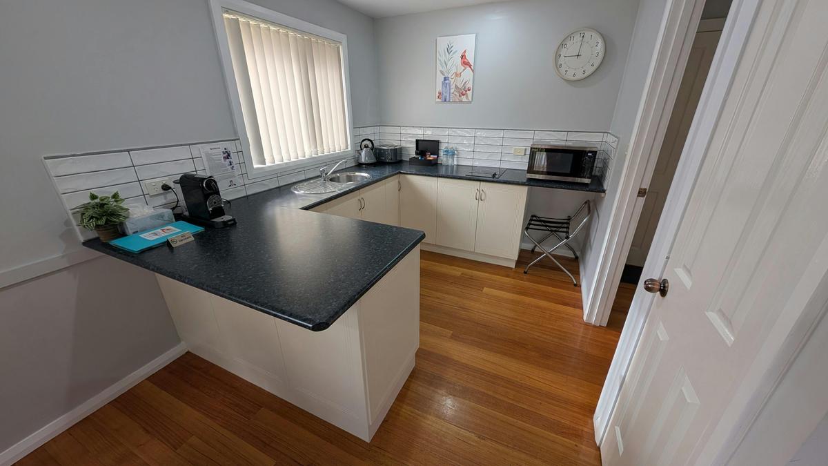 Kitchen Facilities including  fridge, hotplate, convection microwave oven and coffee machine.
