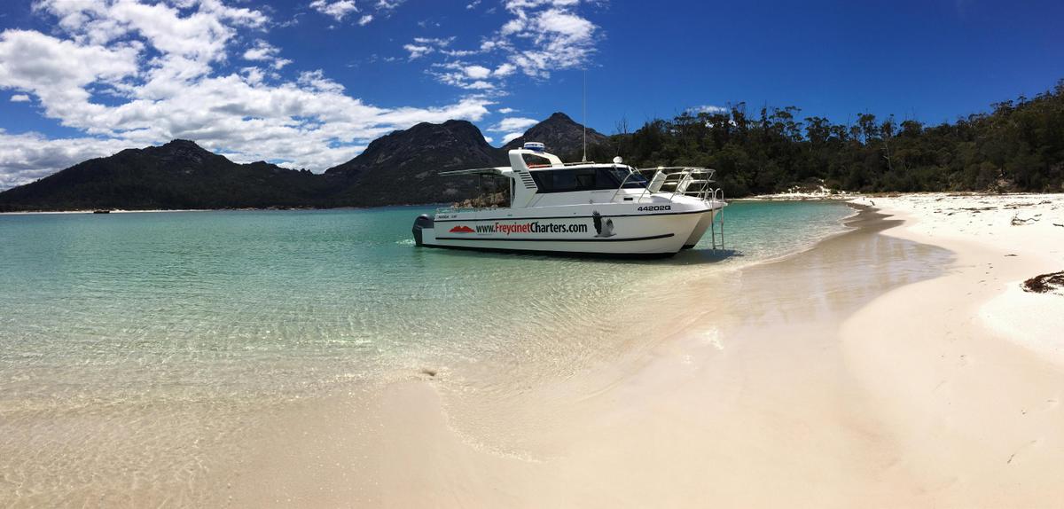 Freycinet Charters taking guests to Wineglass Bay beach