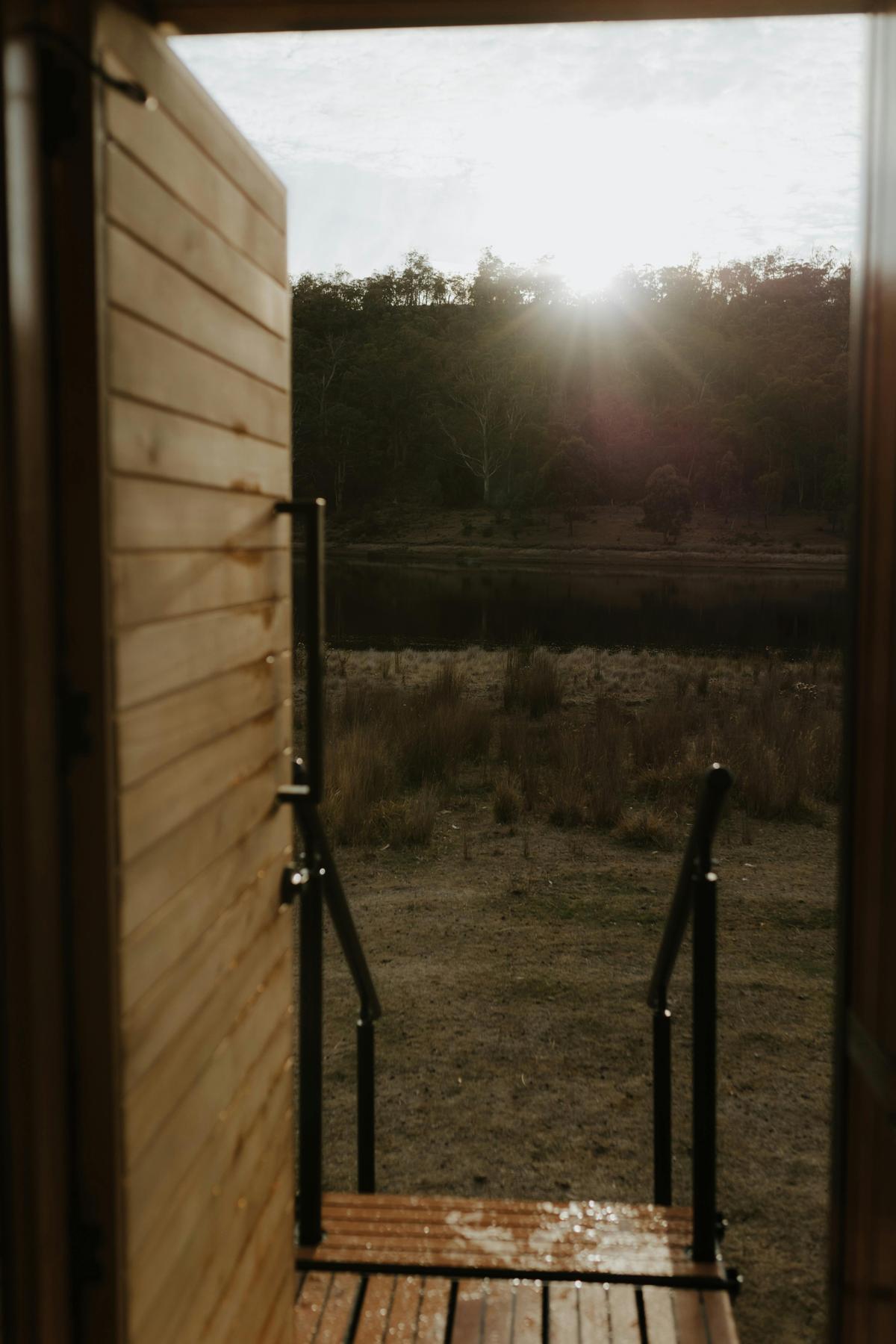 Views across Tasmania's waterways and bushland from the sauna entrance.