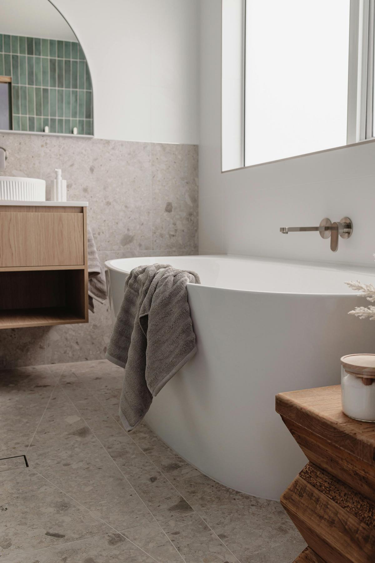 Luxe bathroom with terazzo tiles, high quality tapware and flooded with natural light
