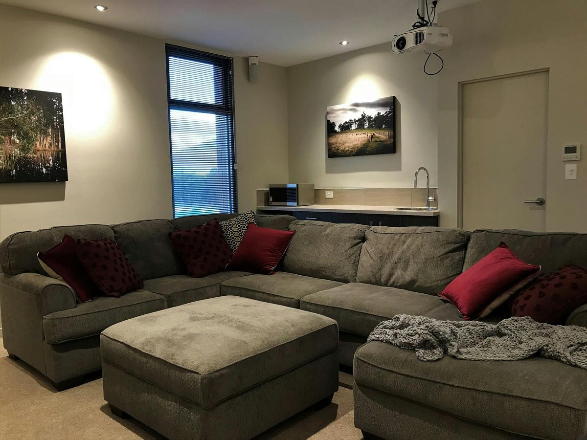 Cinema suite lounge with 2.5 metre by 1.4 metre projection and surround sound