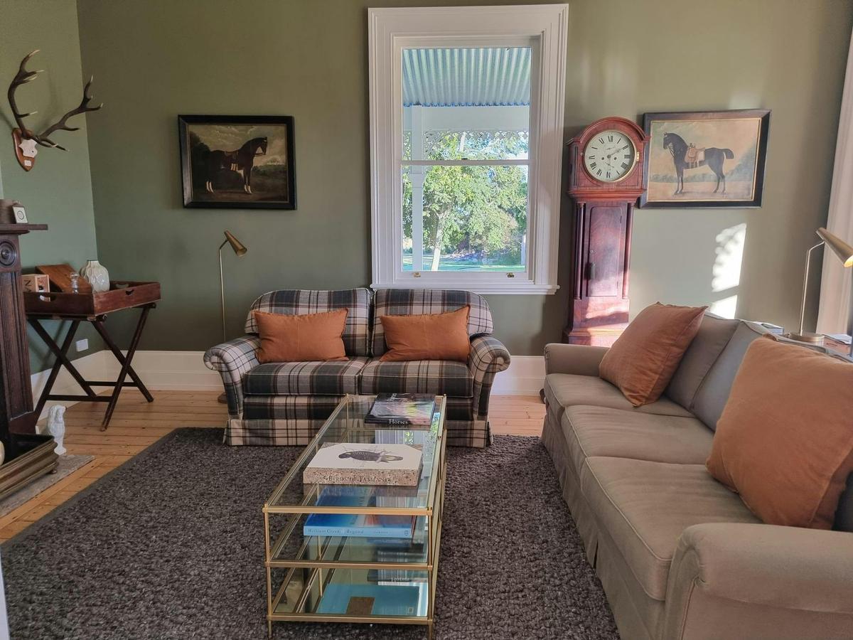 Traditional Georgian Study with antique furniture and contemporary art.