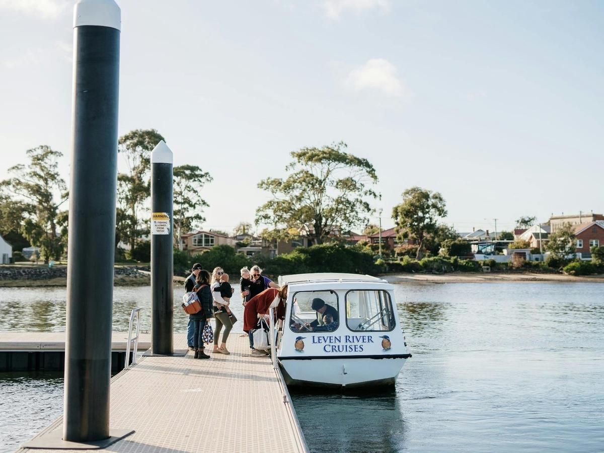Jus' Leven (boat) at jetty in West Ulverstone, family boarding.