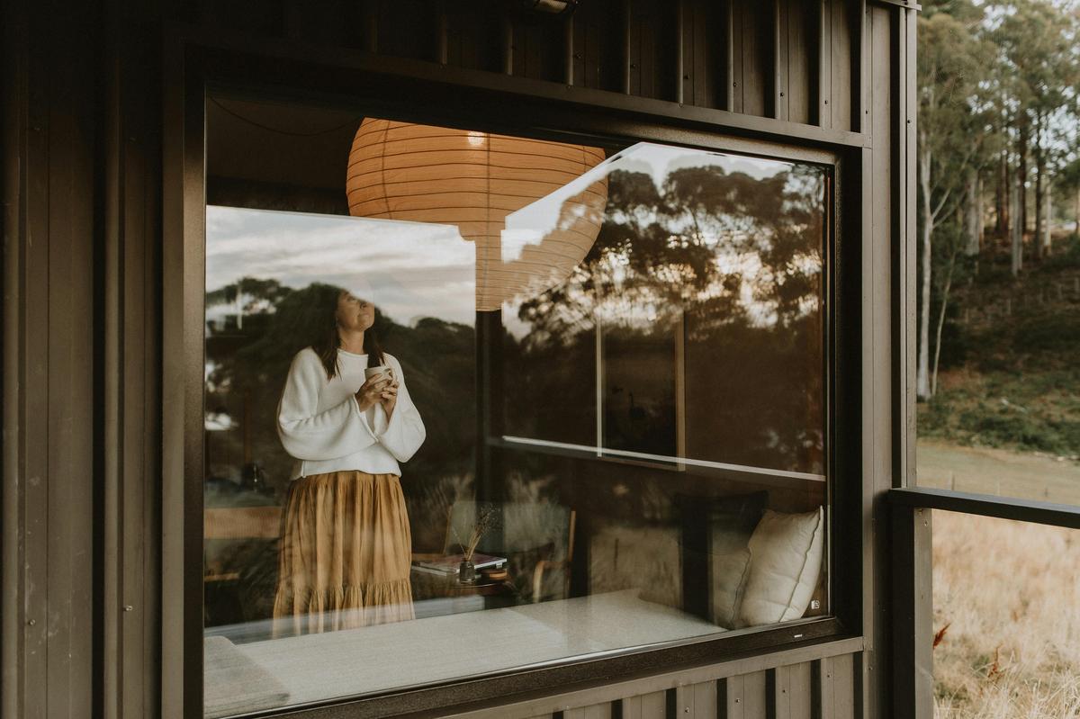 Lady looking out a window