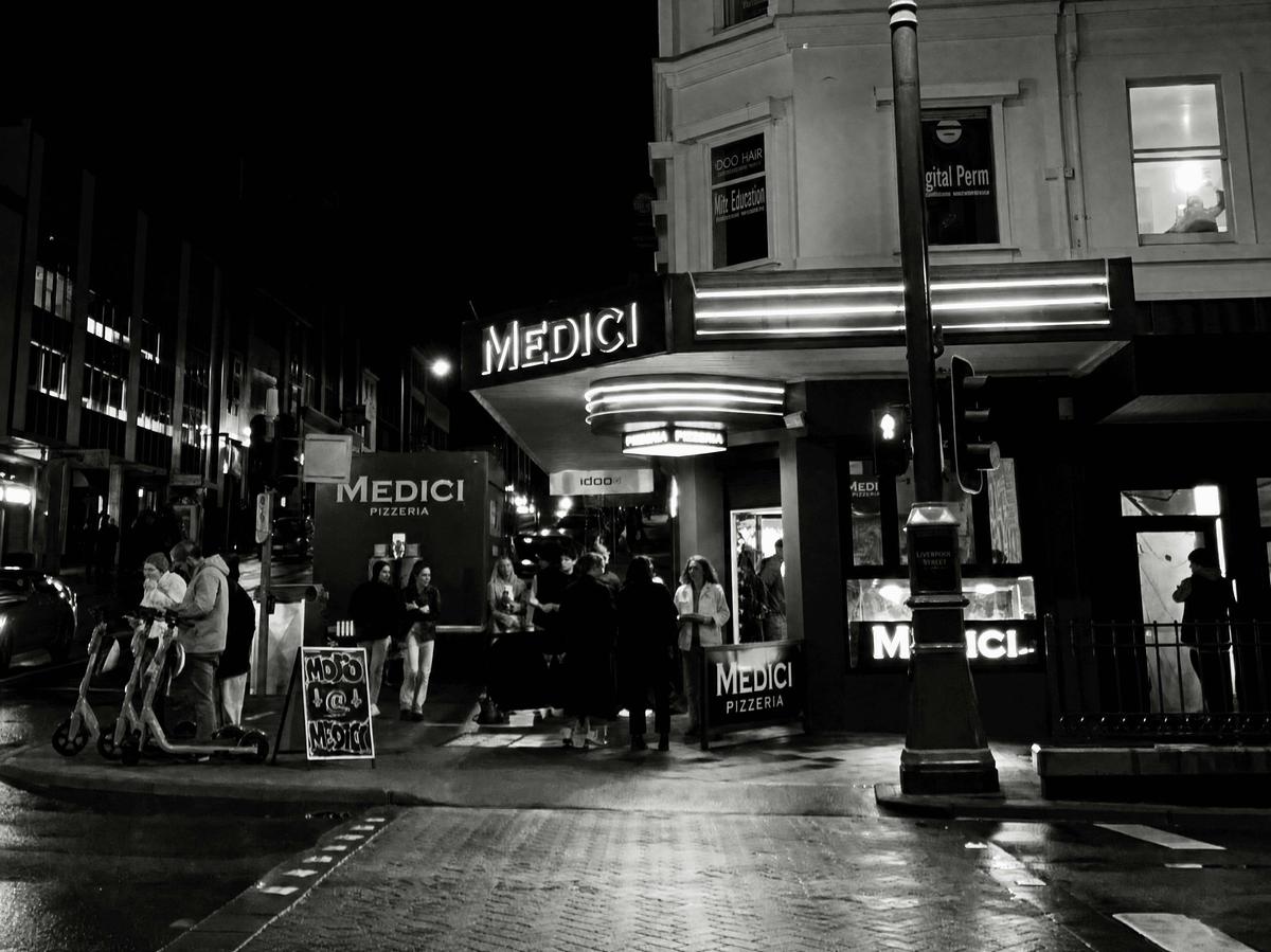The Medici Pizzeria corner in central Hobart on a  winter evening