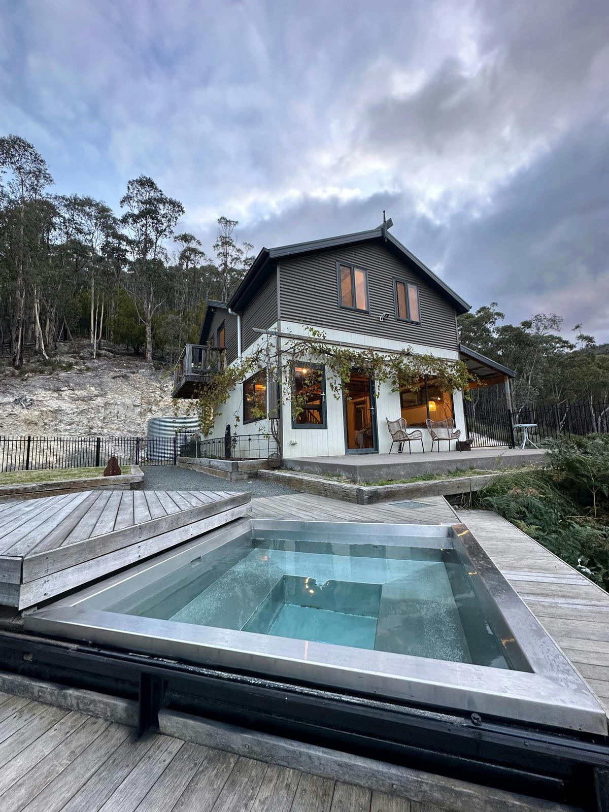 The custom made thermal spa has a timber cover that slides back to reveal the constantly warm spa