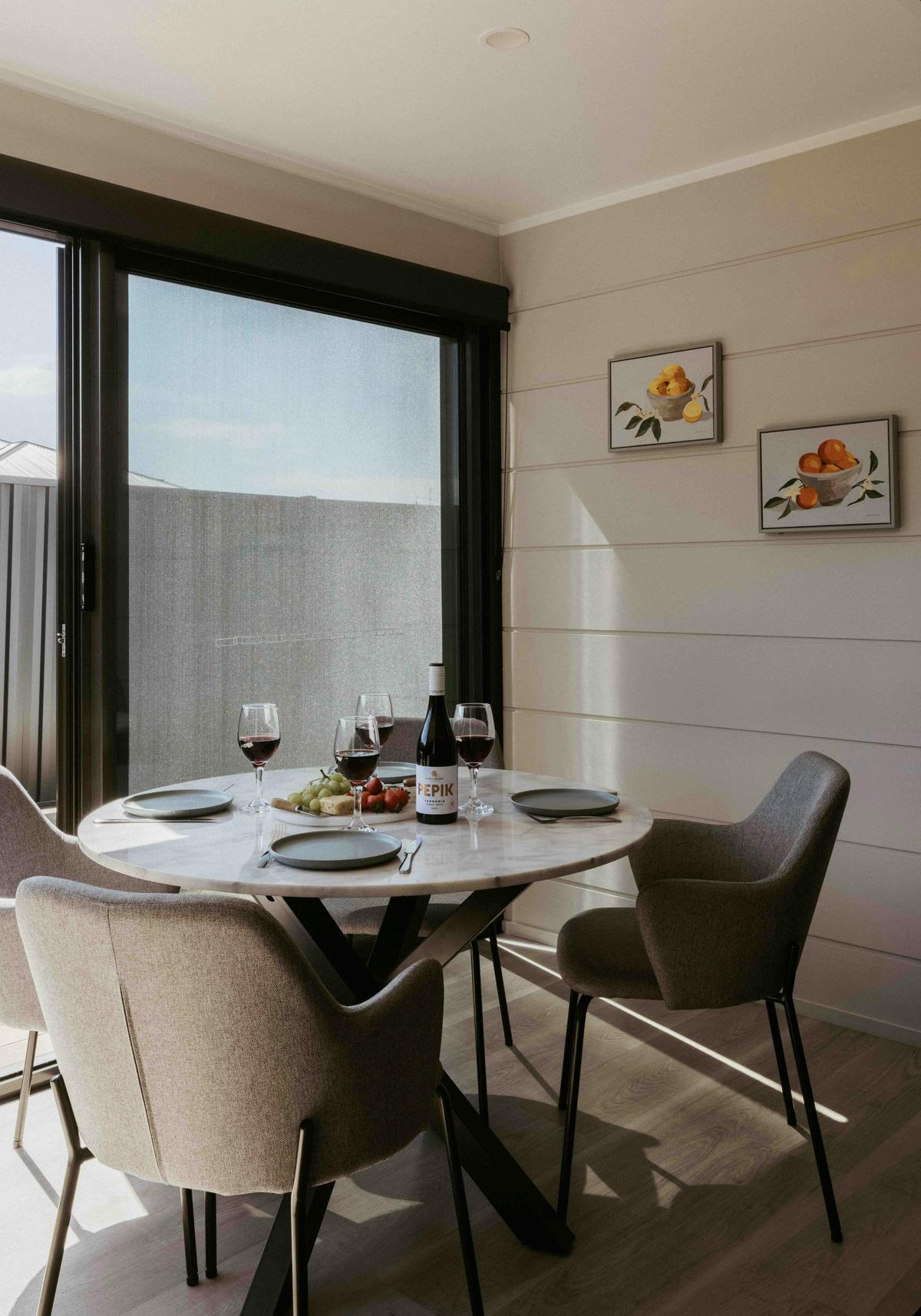 Enjoy meals in the bright, light-filled dining area, offering a warm and inviting atmosphere.