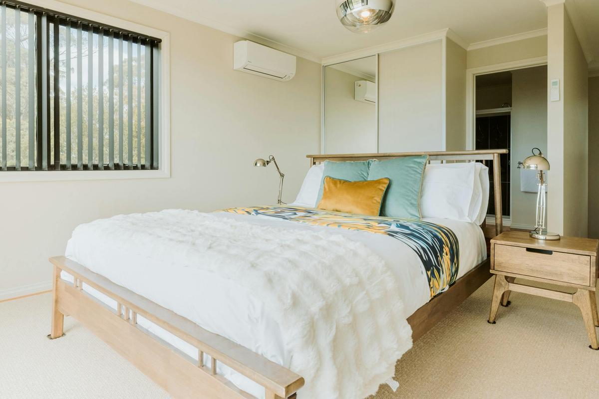 Stunning views from the upstairs master bedroom, featuring a queen bed and ensuite.