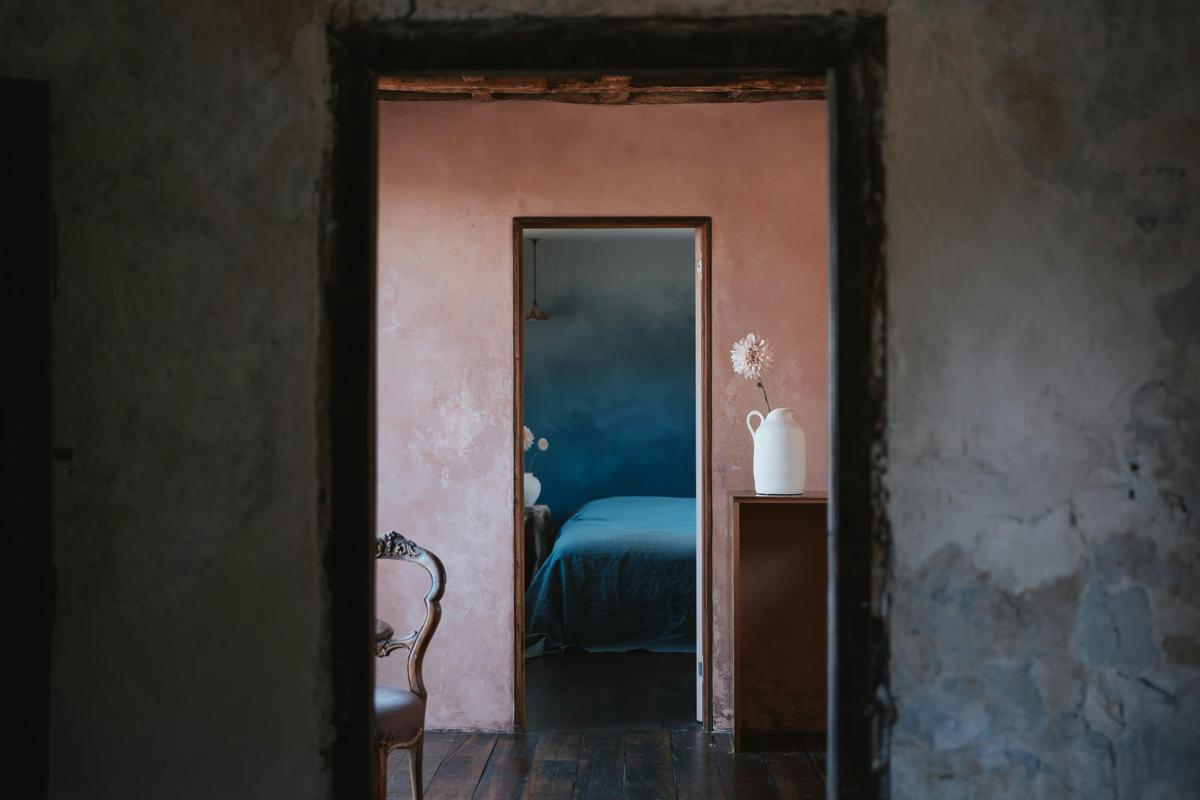 Textured walls and thoughtful colour schemes pay homage to the buildings history and surroundings
