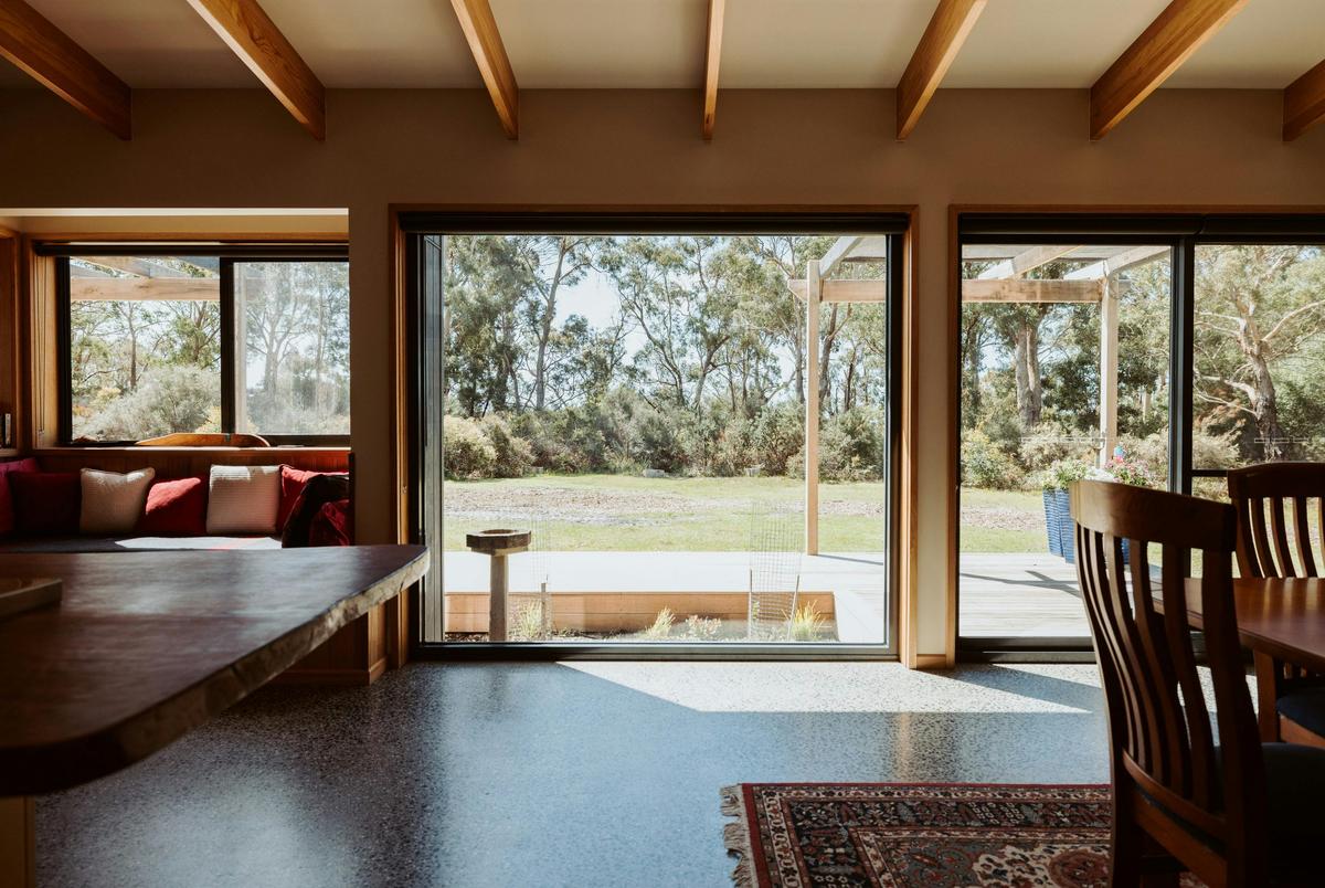 Step inside to sweeping views of the surrounding bushland.