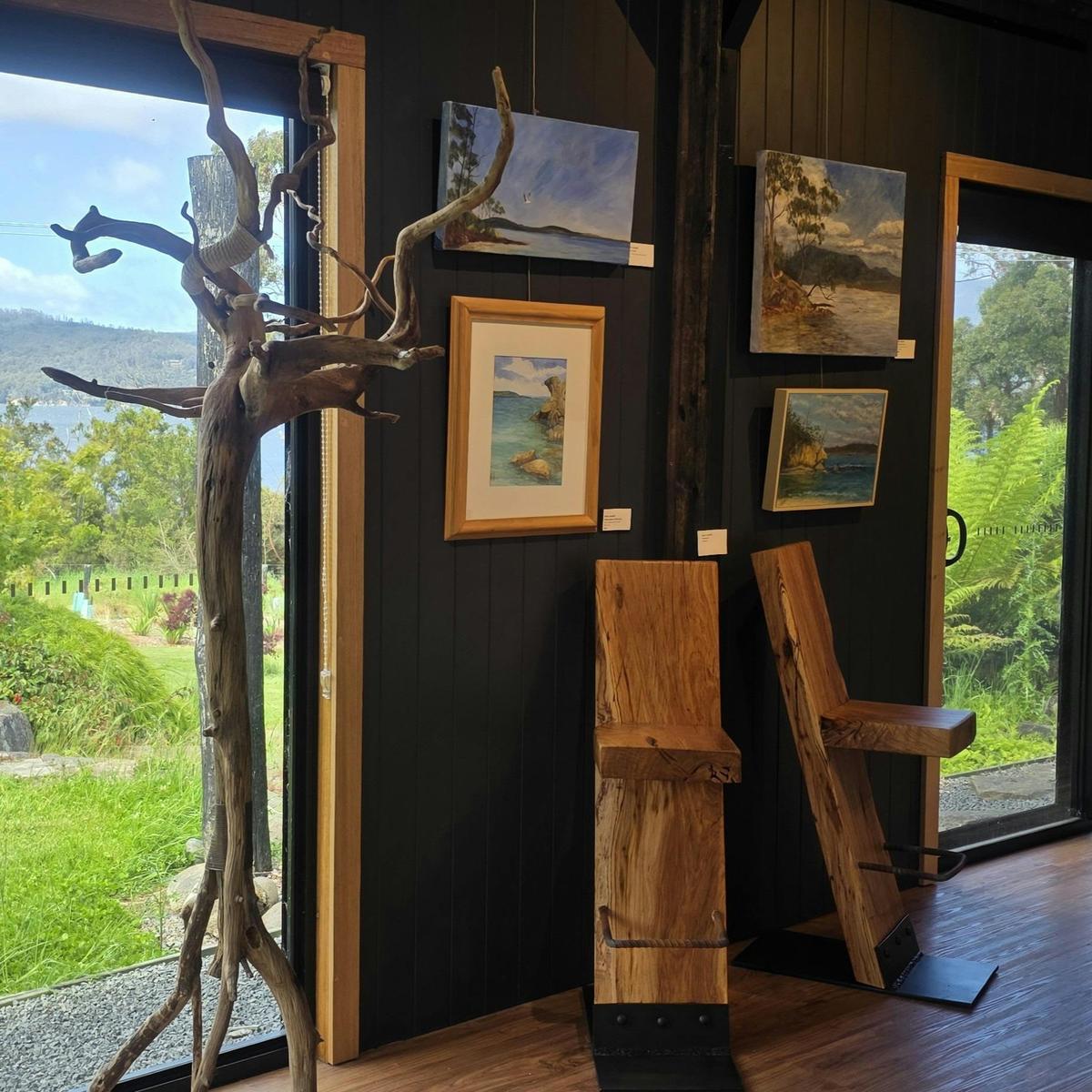 Timber barstools, driftwood hatstand, watercolour and oil paintings