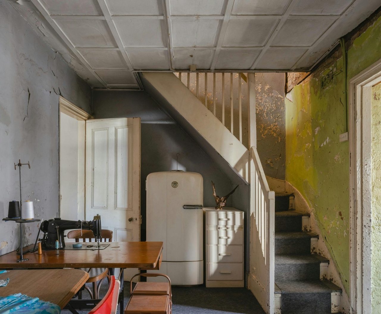 Historic kitchen with stairs leading upstairs