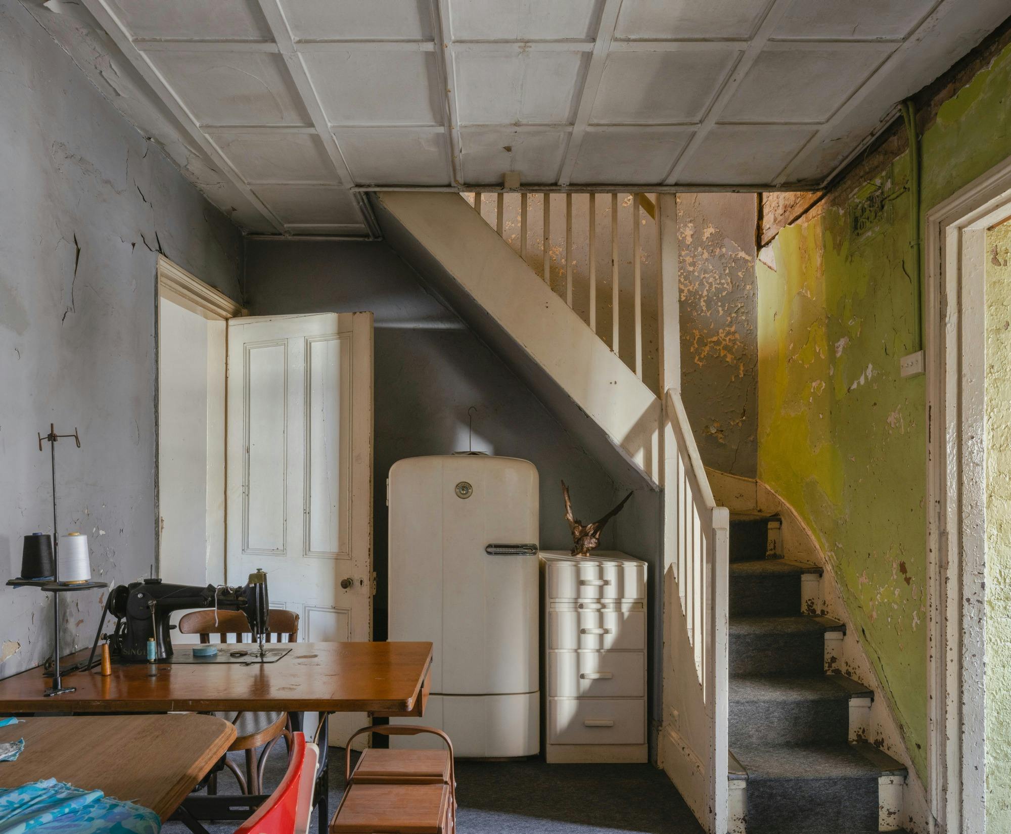 Historic kitchen with stairs leading upstairs