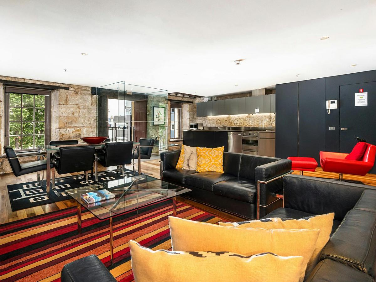 Large light filled modern apartment in a historic sandstone Salamanca Place building.