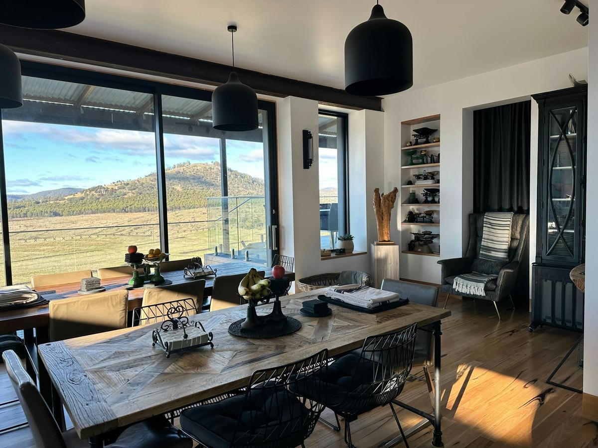 Beautiful rustic, industrial kitchen and dining space, facing view.