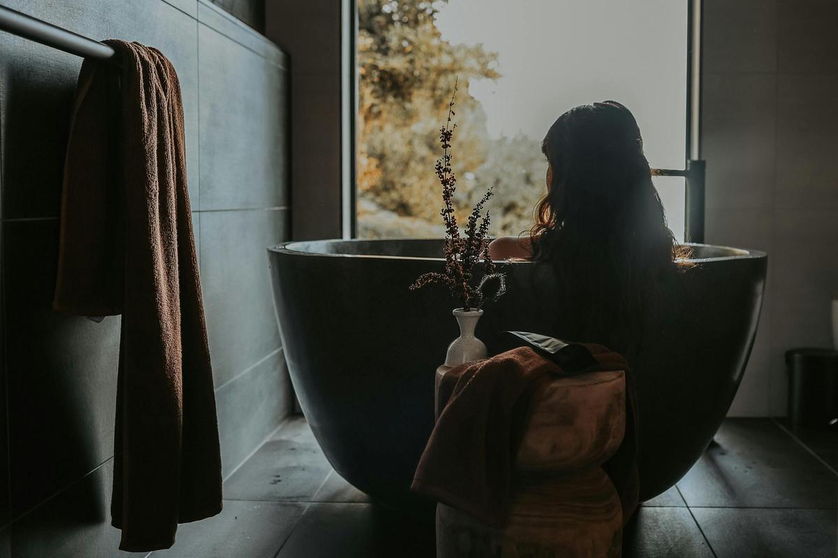 Charcoal bath in the master ensuite with stunning views over Sandpiper Beach
