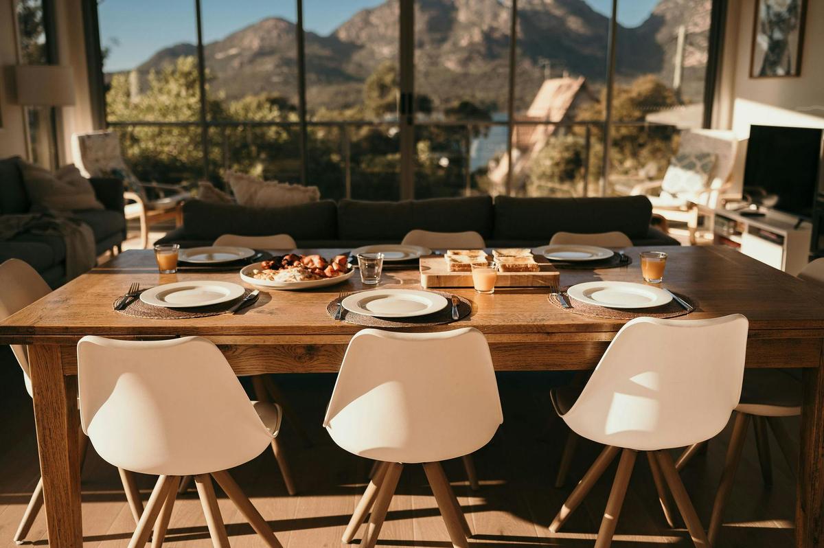 Indoor dining table with a back drop of the Hazards Mountains