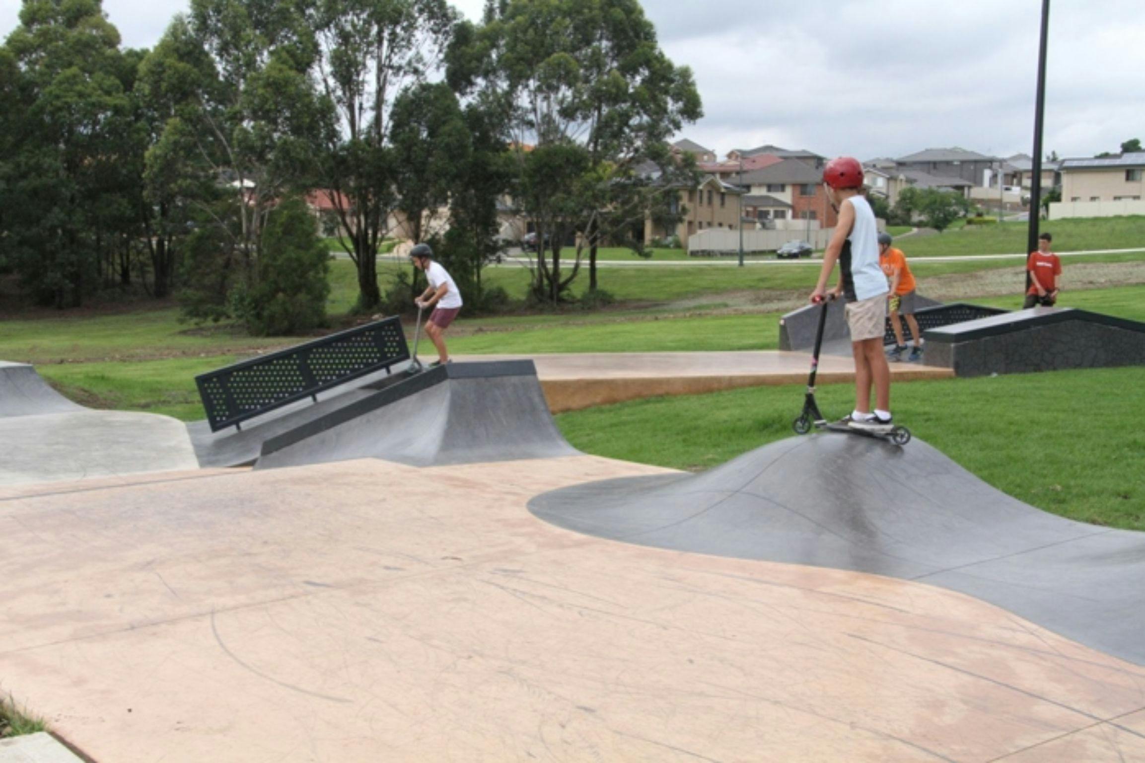 children playing at skate park
