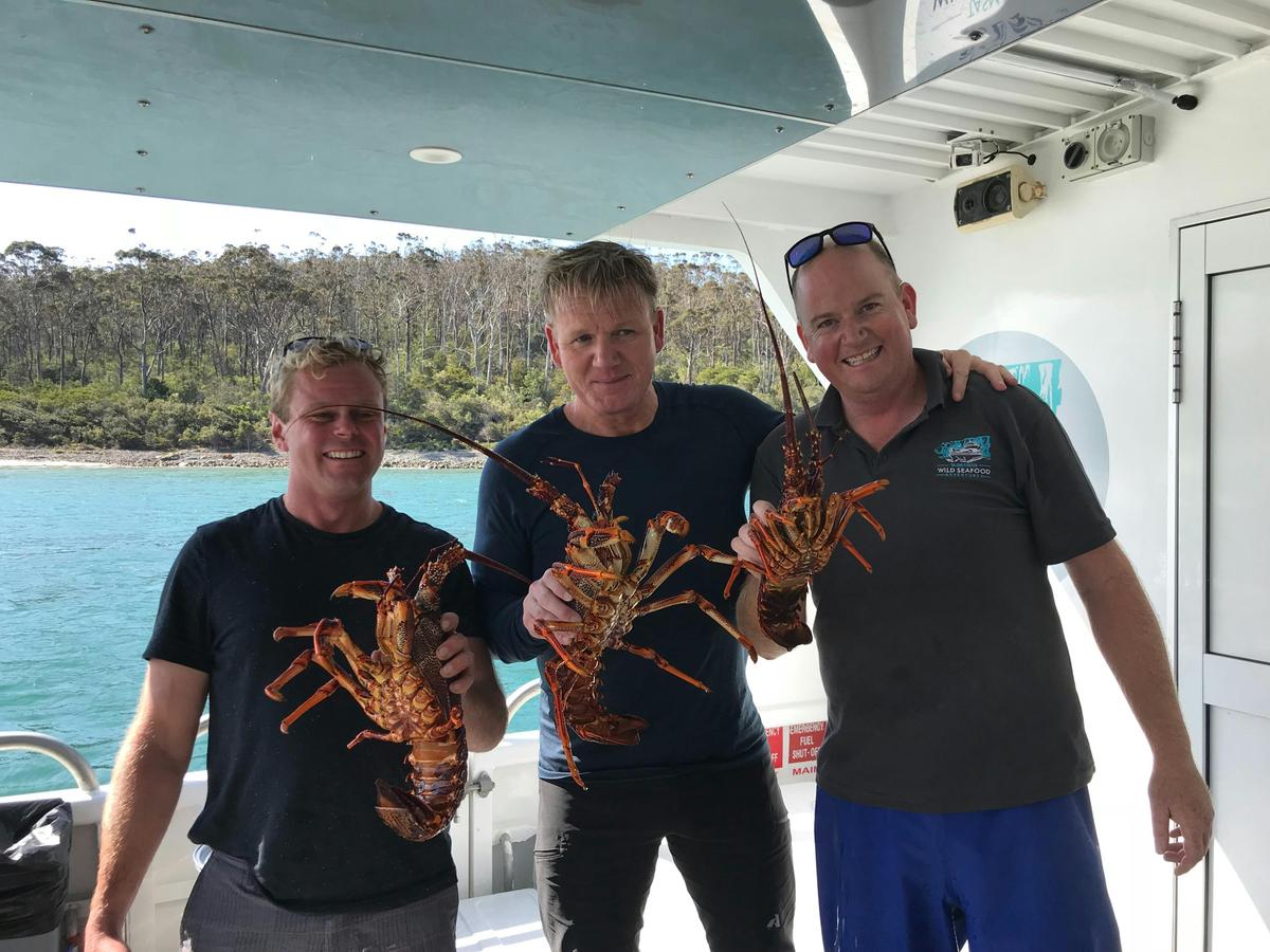 Gordon Ramsay, Shane Wilson and Nick Daft with rock lobsters. Filming Unchartered.