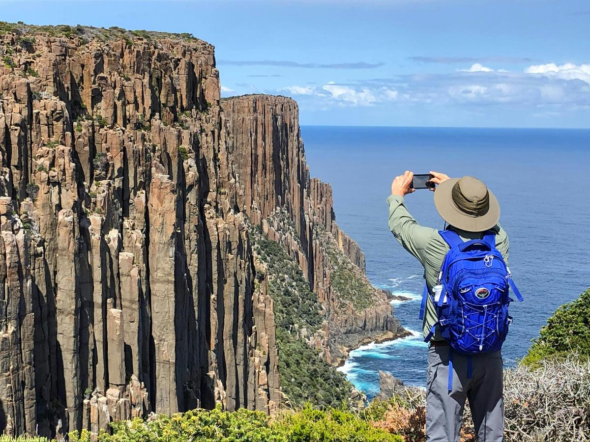 Capturing the towering sea cliffs of the Three Capes Walk, one of Tasmania’s most iconic coastal exp