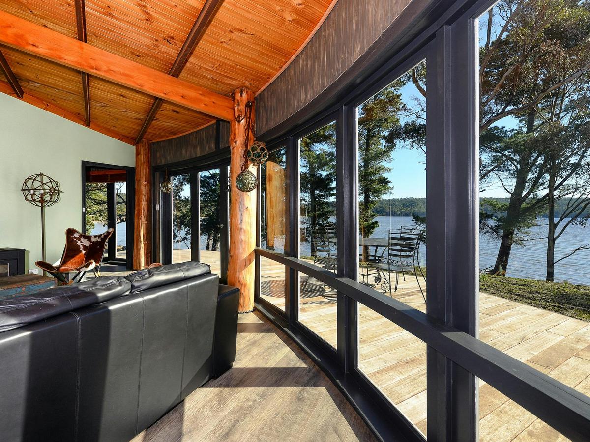 Taylors Bay Cottage: lounge area and view over Taylors Bay.
