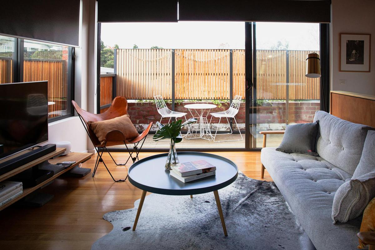 The sun filled living area with stacking doors to let the outside in or enjoy your evening drinks.