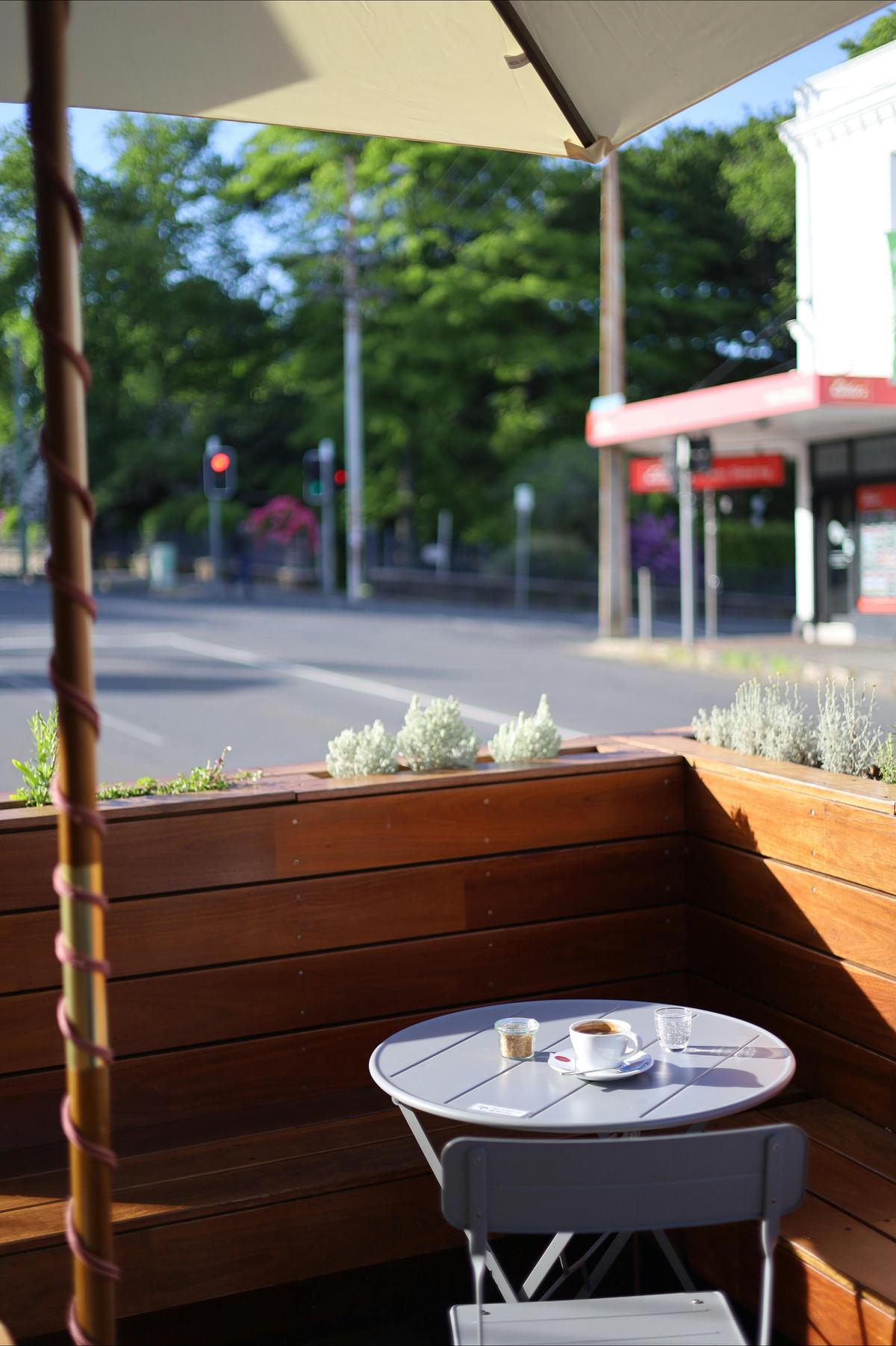 Our outdoor parklet in the morning sun, with a coffee overlooking Princes Square