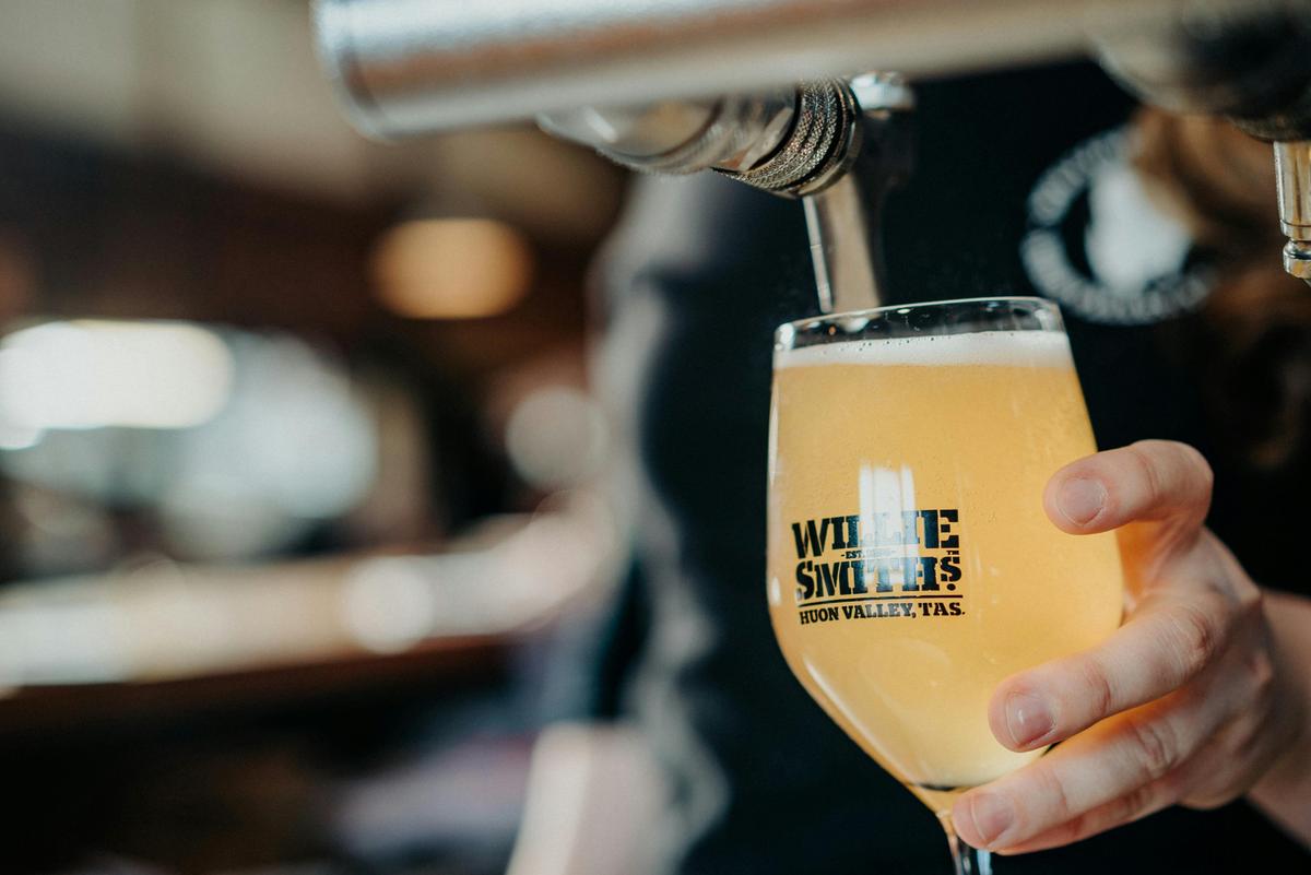 Cider being poured at Willie Smith's Apple Shed