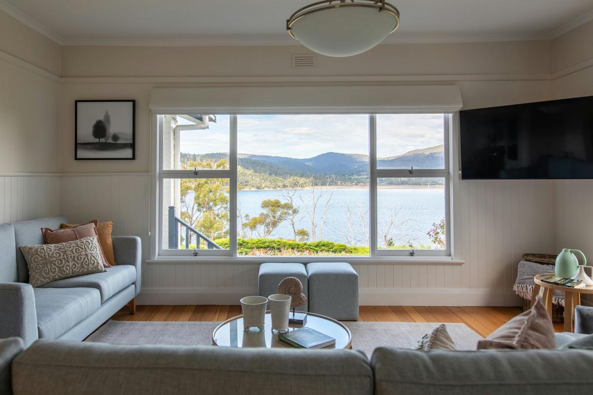Living room with a view at Woodland Bay Retreat