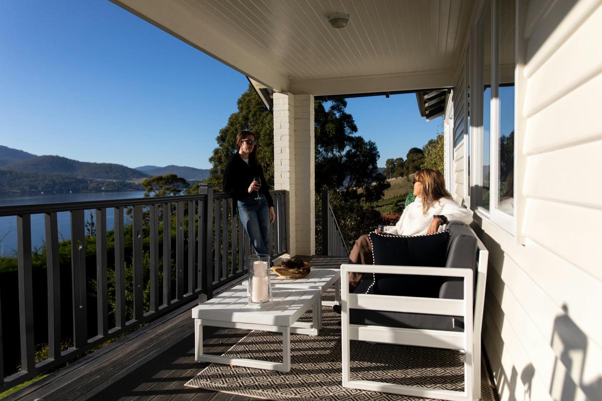 Relax on the expansive balcony at Woodland Bay Retreat