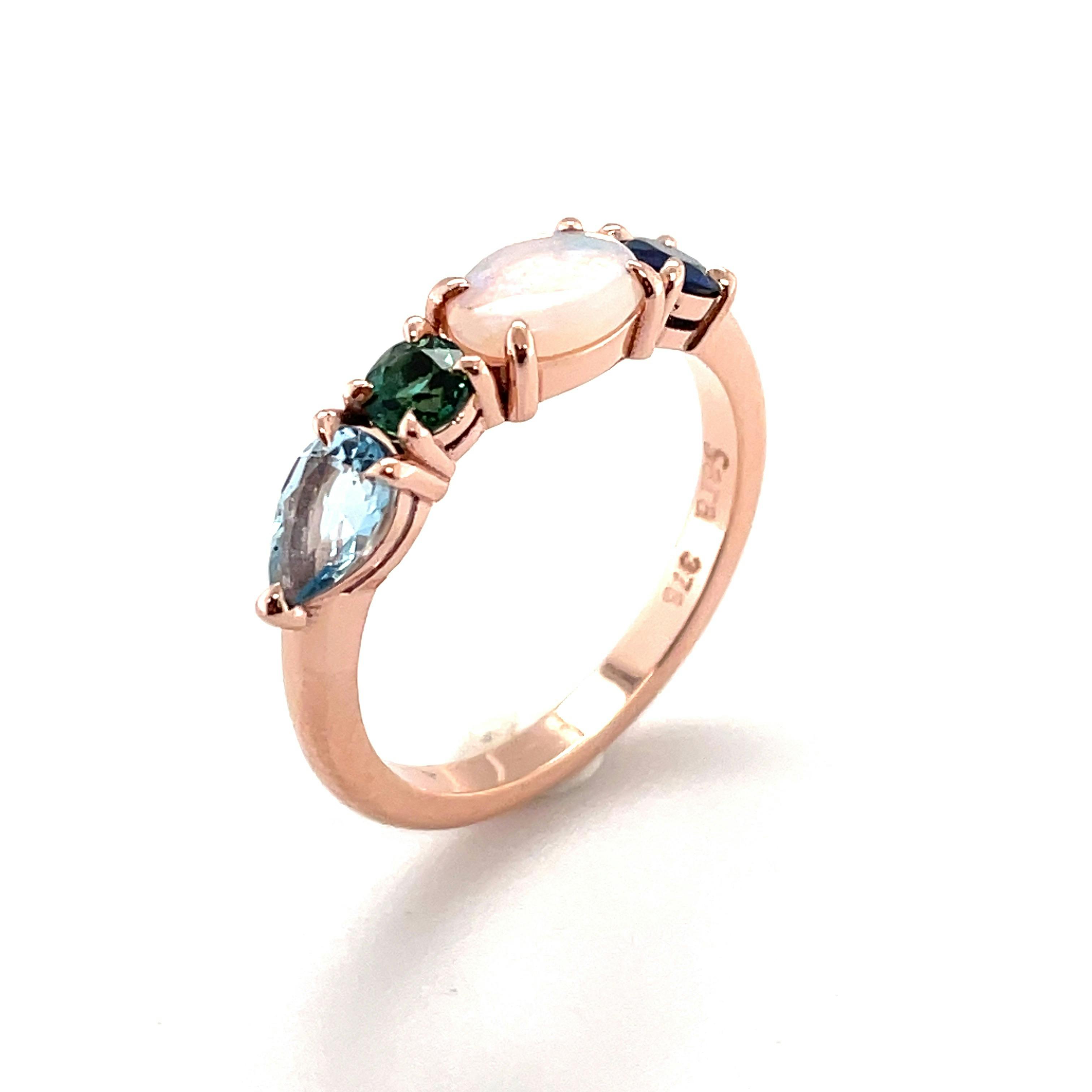 Custom made multi-gemstone ring as a 21st birthday gift with aquamarine, tourmaline, opal & sapphire