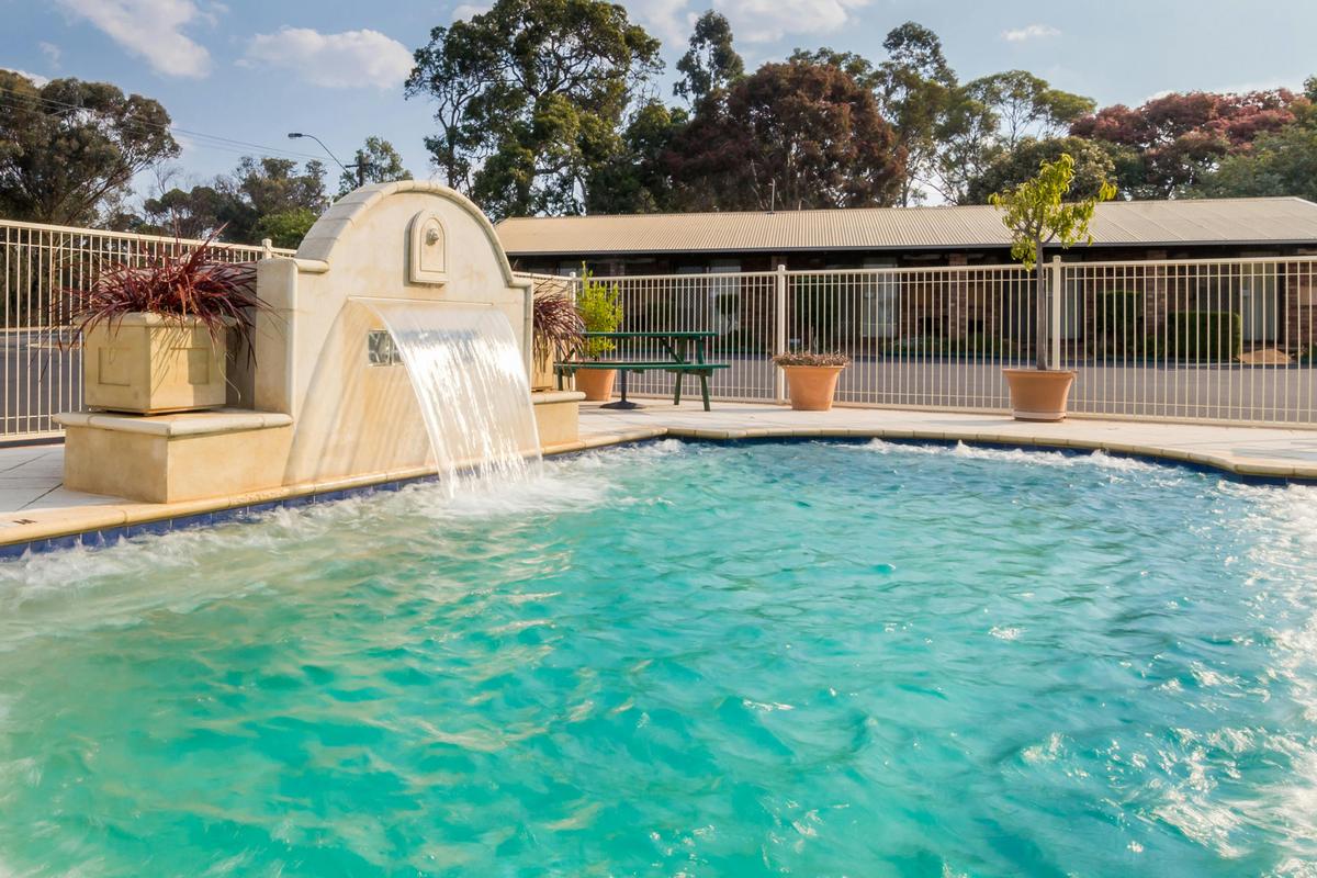 Spa swimming pool with cascading waterfall