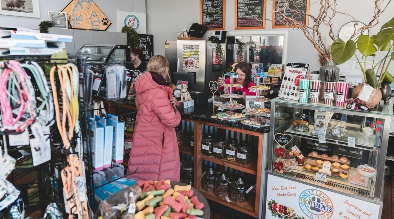 person at check out counter at shop