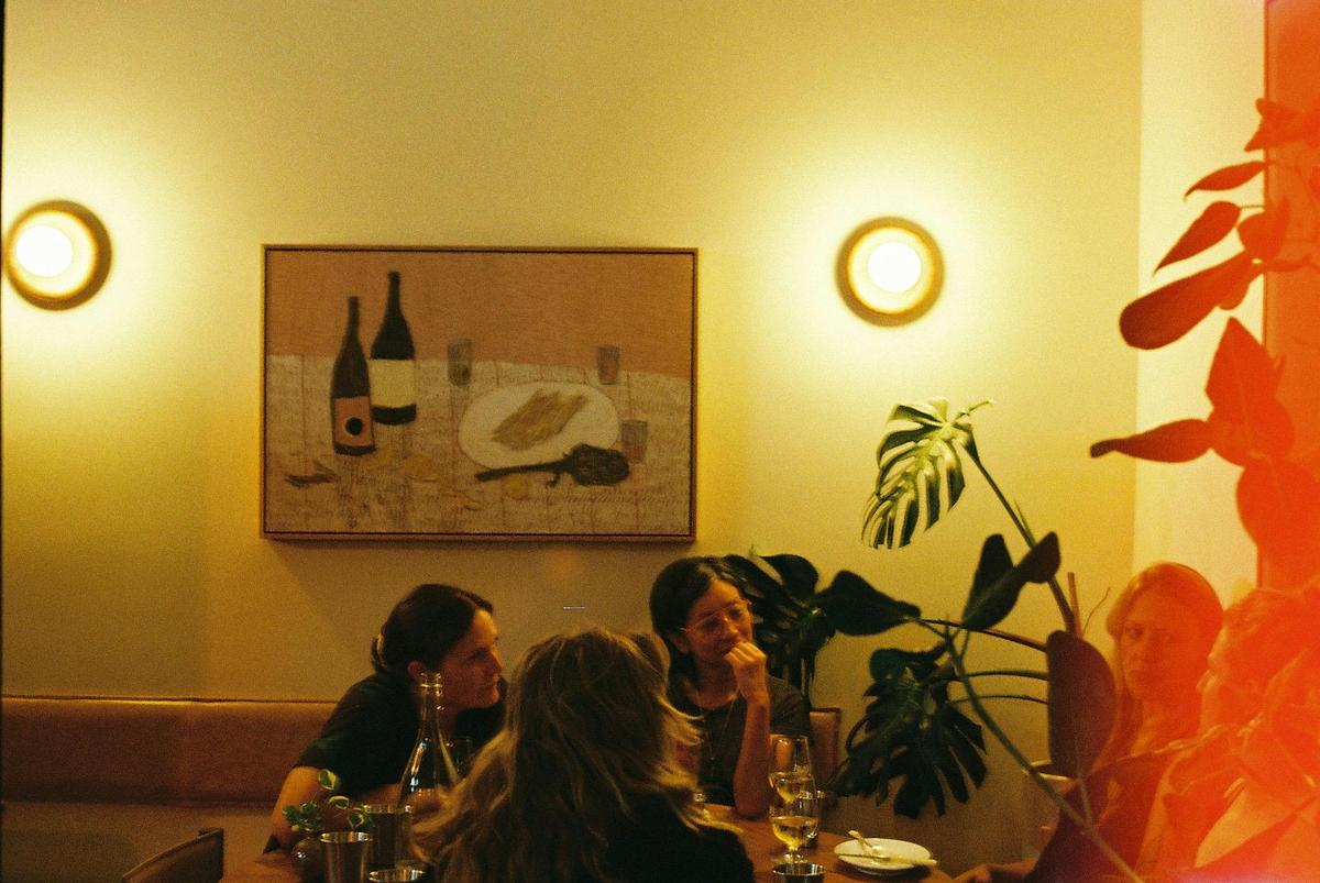 Guests enjoying wine and food