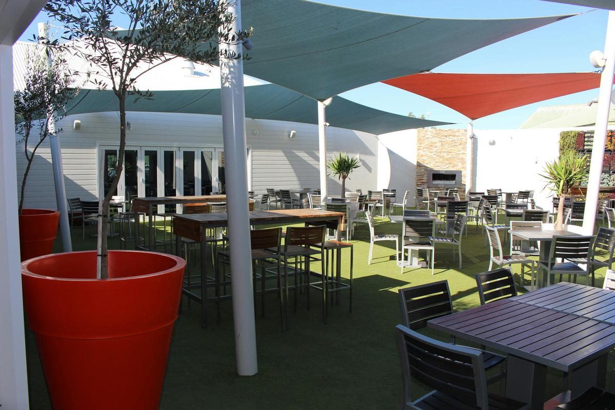 Sails - Bill's Beer Garden, featuring greenwall and gas fireplaces.