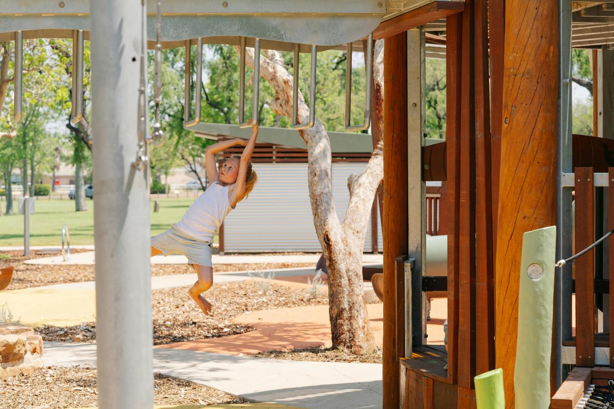 Child playing on a climbing frame at the Kununurra All Abilities Playground