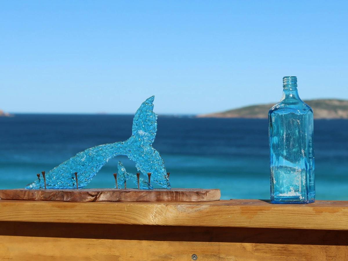 Recycled Art Sculpture made from glass bottle waste celebrates the beauty and whales of Esperance,