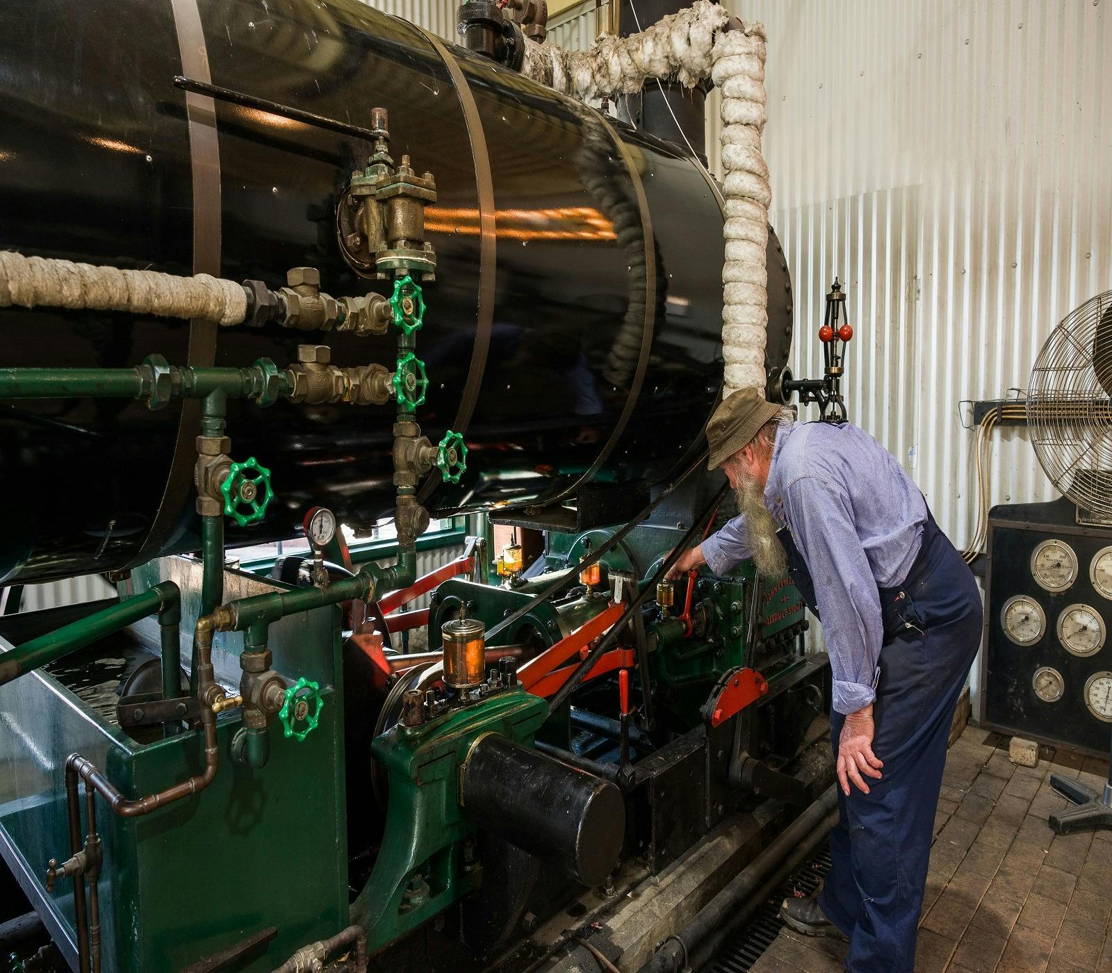 Photo of one of the volunteers running the steam engines
