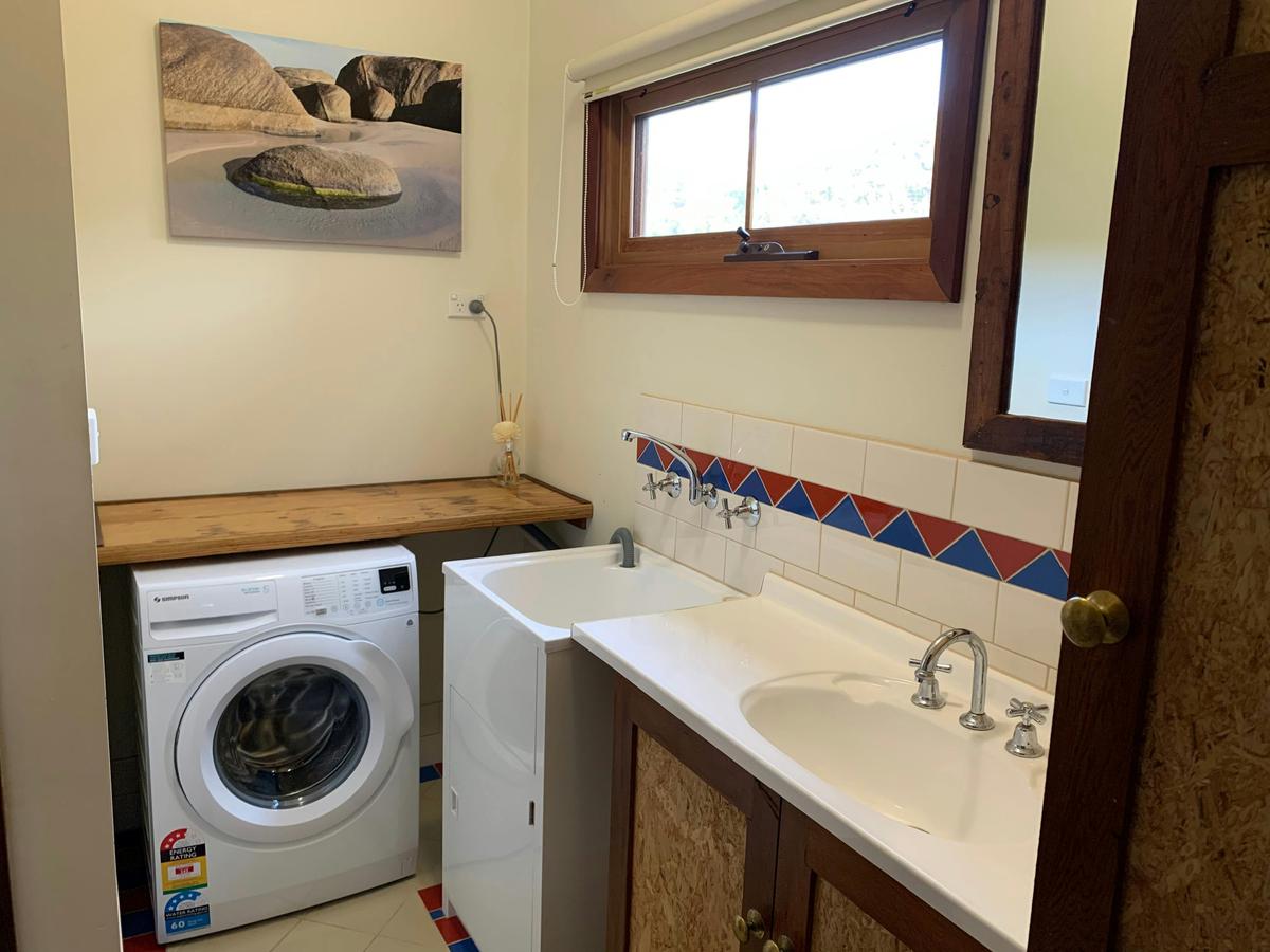 Cowrie Cottage Laundry and Bathroom