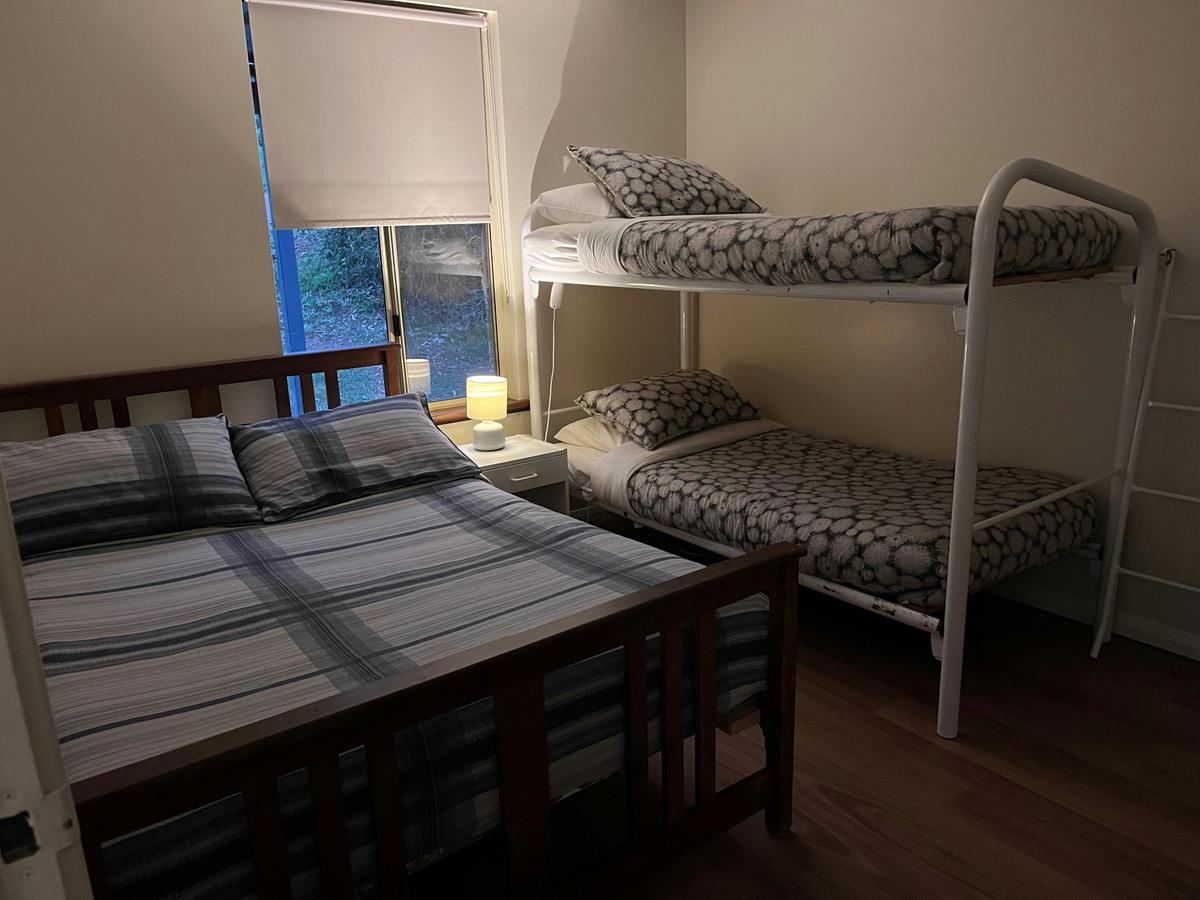 Sheoak cottage second bedroom with double bed and bunk bed