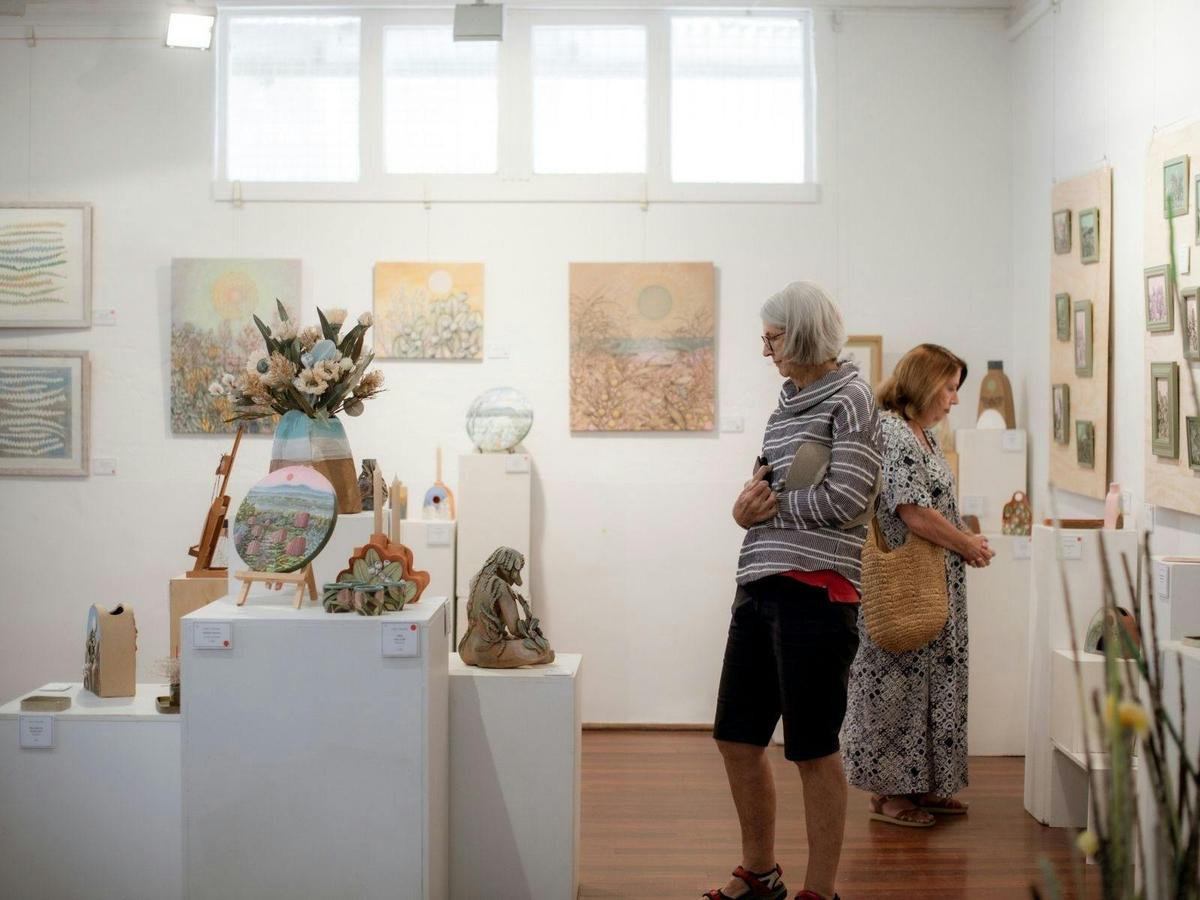 Visitors to the BLOOM Exhibition by artists Naomi Stanitzki and Mylene van Heijster April 2023
