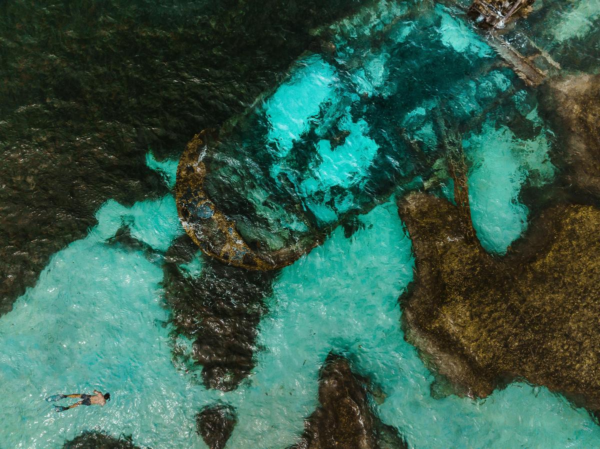 Snorkeller and shipwreck