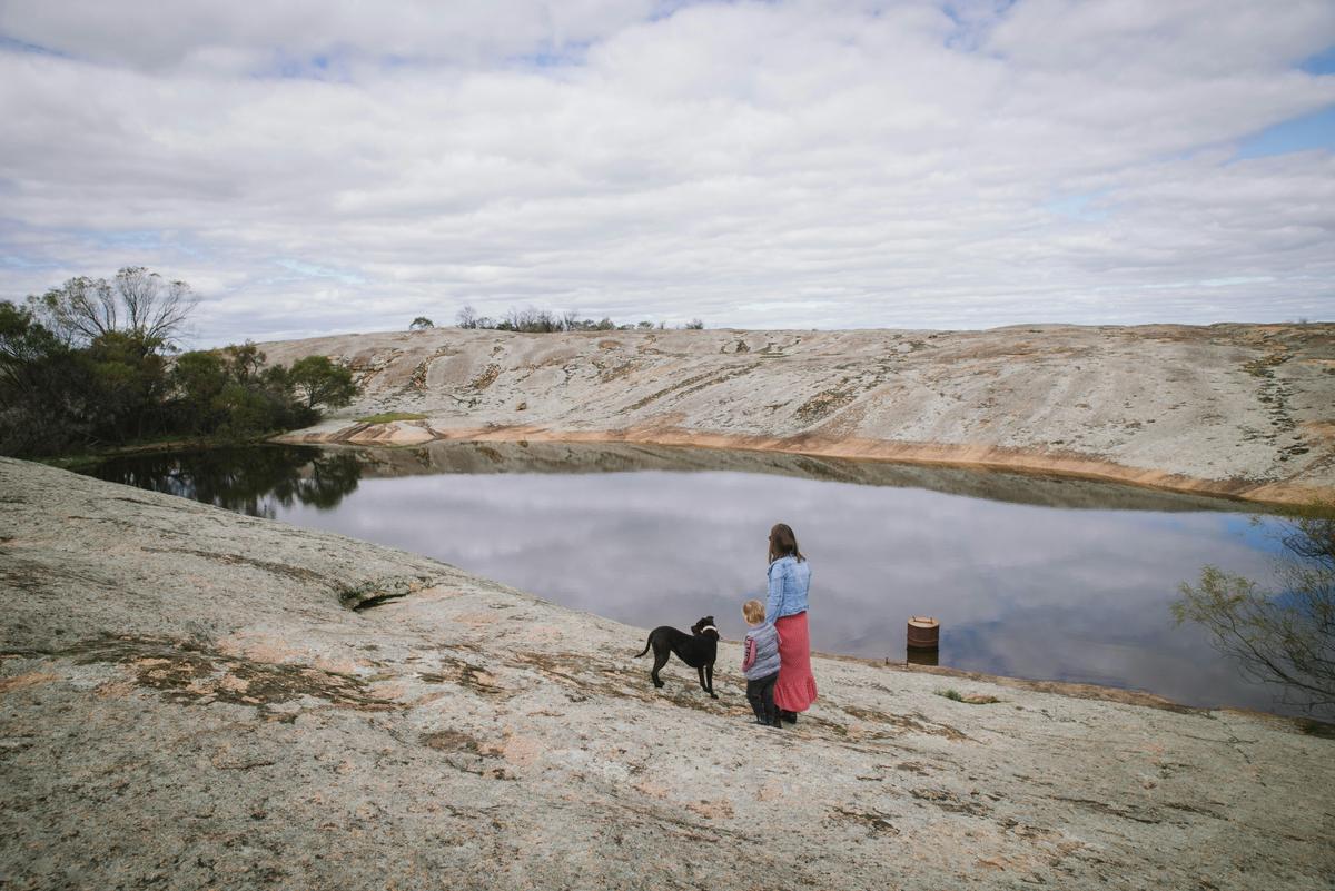 Take in the beauty of a tranquil waterhole framed by granite landscapes.