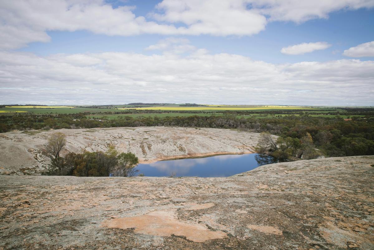 Hidden within granite outcrops, this tranquil waterhole offers scenic views.