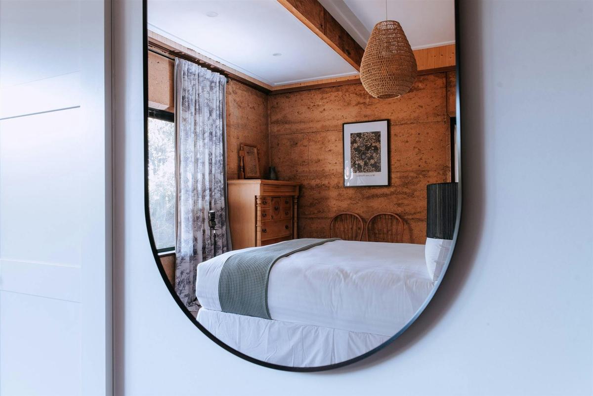 Reflection of the rammed earth walls downstairs