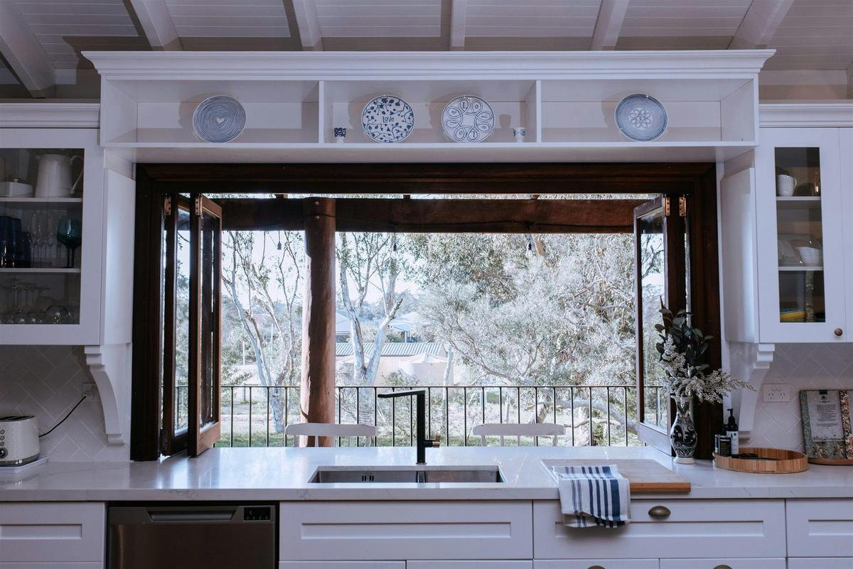 The view to the garden and upstairs veranda through  bifold windows