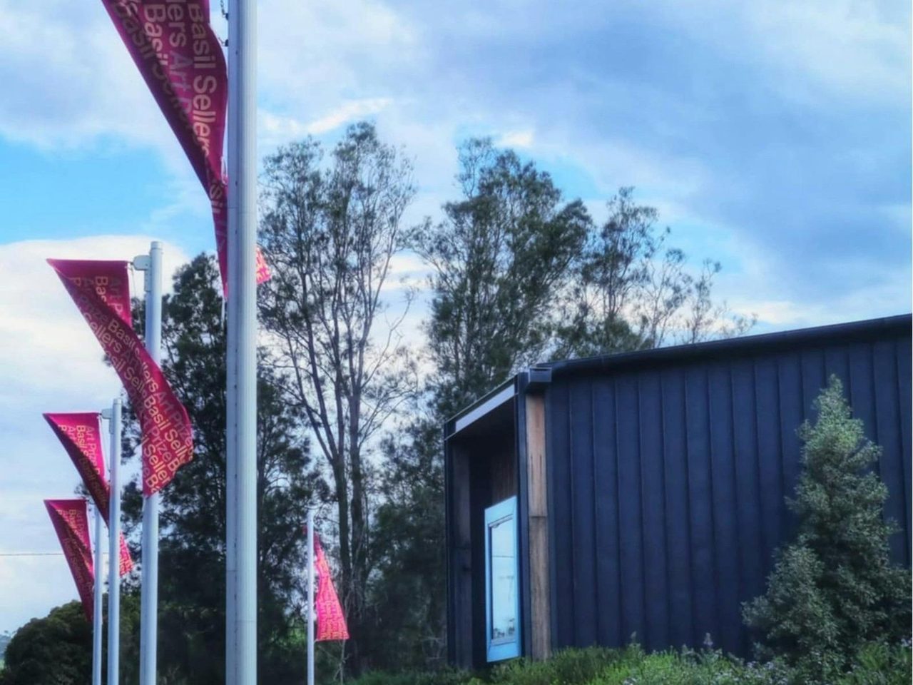 The Basil Sellers Art Prize flags flying outside the gallery.